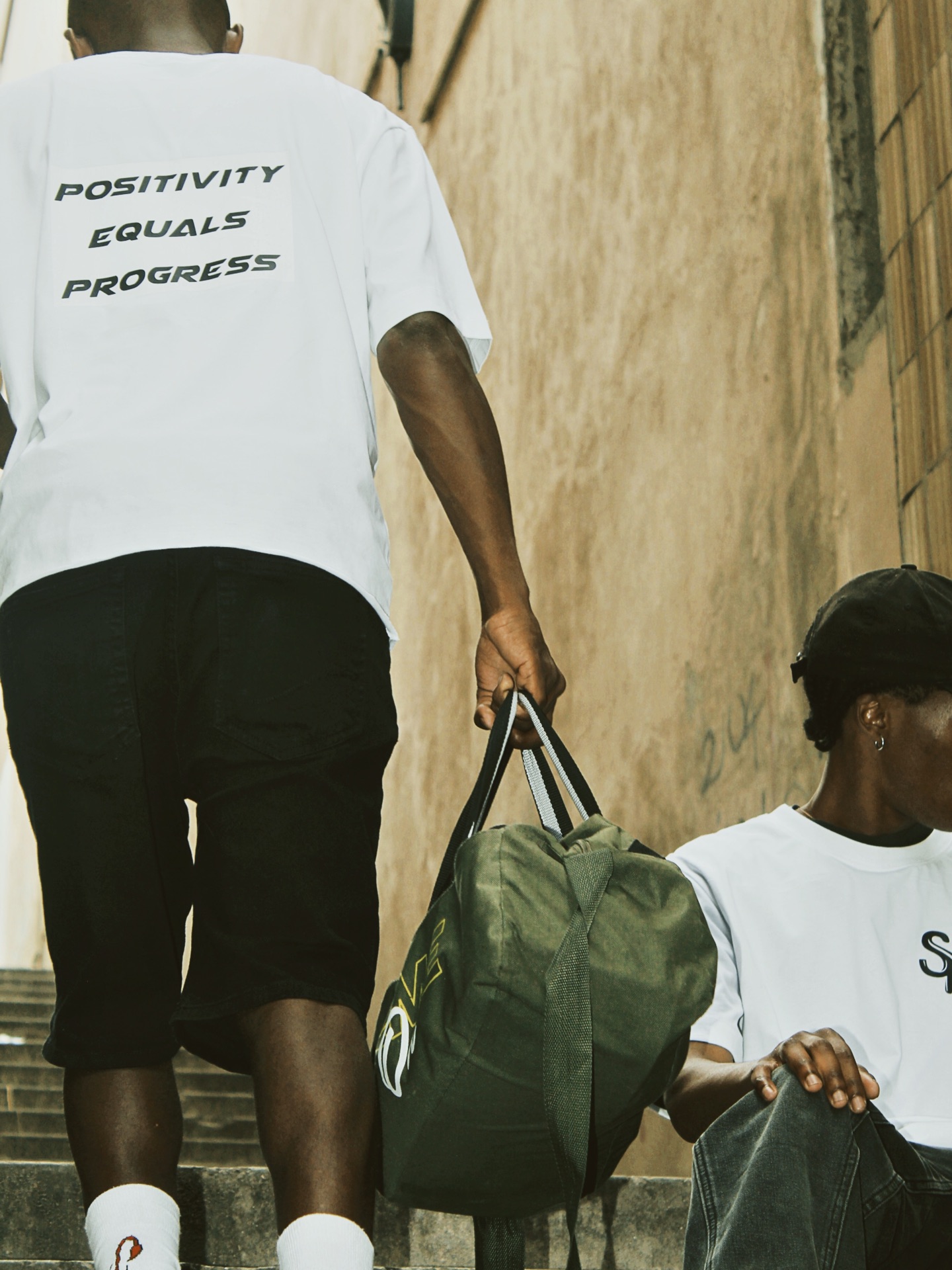 Sqedi Mandatory Positivity Equals Progress tee worn on the streets of Port Elizabeth